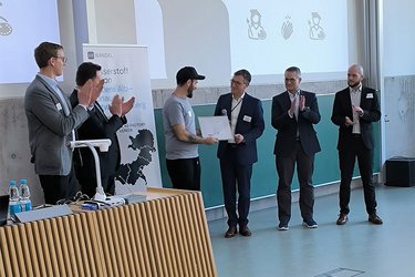 Preisverleihung des Gestaltungswettbewerbs mit Künstler Johannes Blinkle sowie den Sponsoren in der Aula der Hochschule Rottenburg